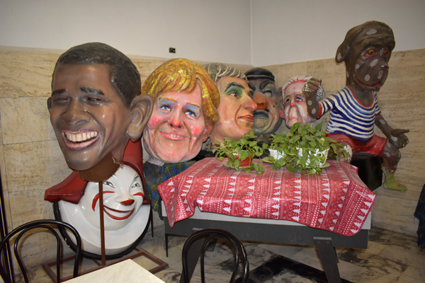 parade masks (?), railway station cafe, Viareggio